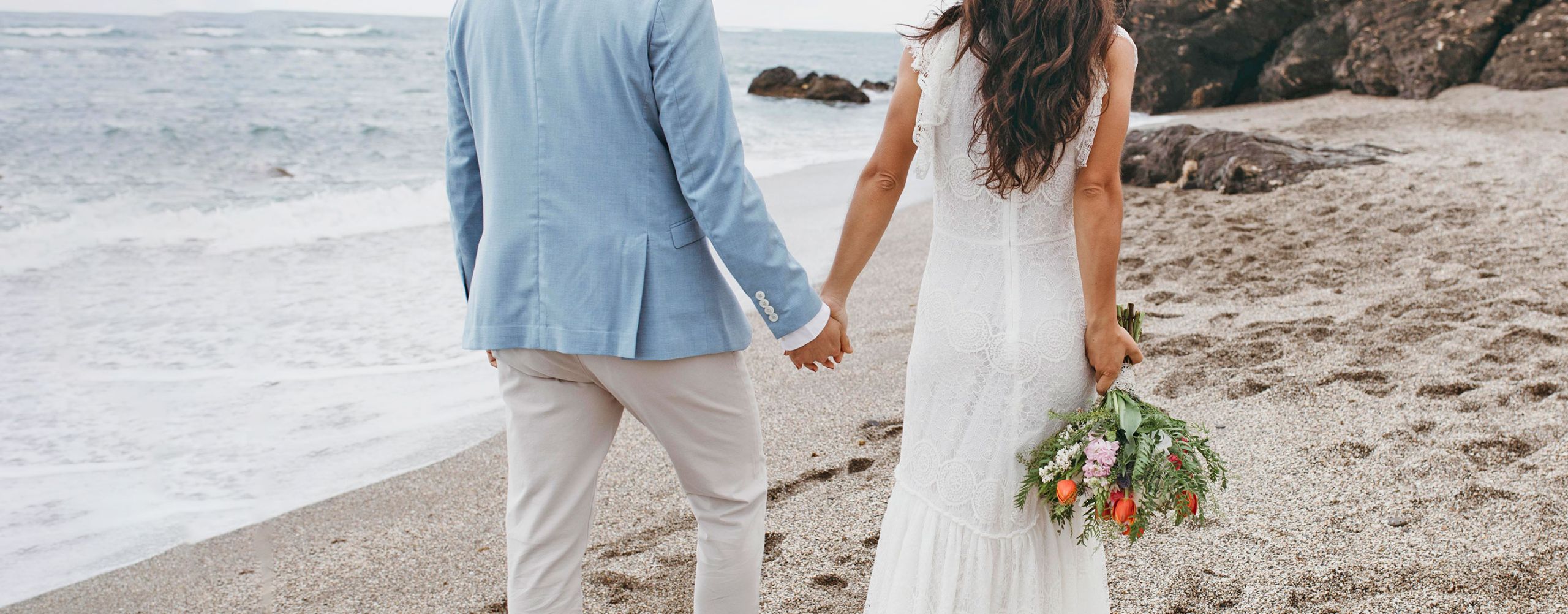 A couple during a wedding photo shoot in a beach in Ibiza